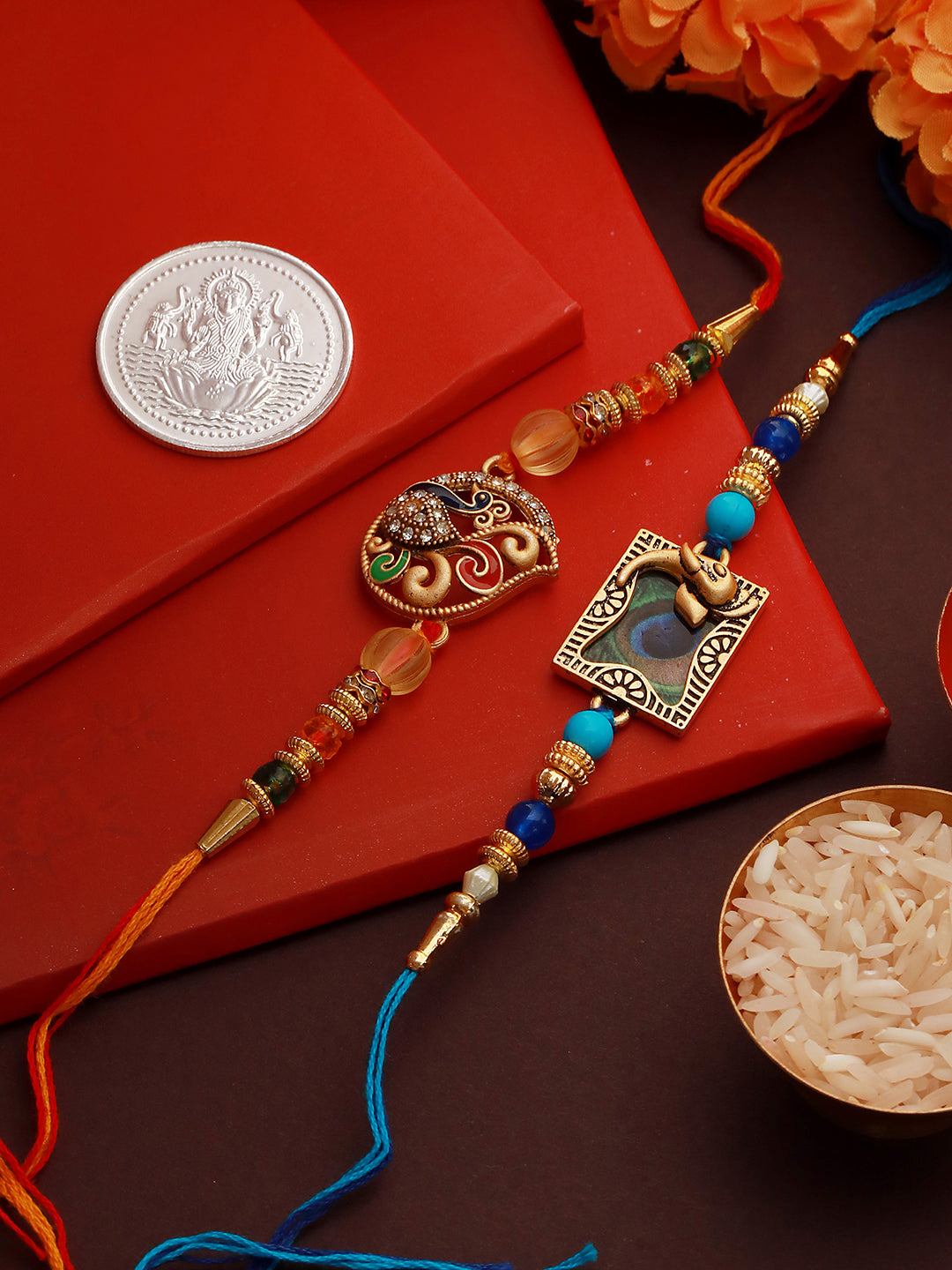 Set of 2 Kundan Studded Peacock Shaped Rakhi with 10 gram Laxmi Ganesh round 999 Round Silver Coin
