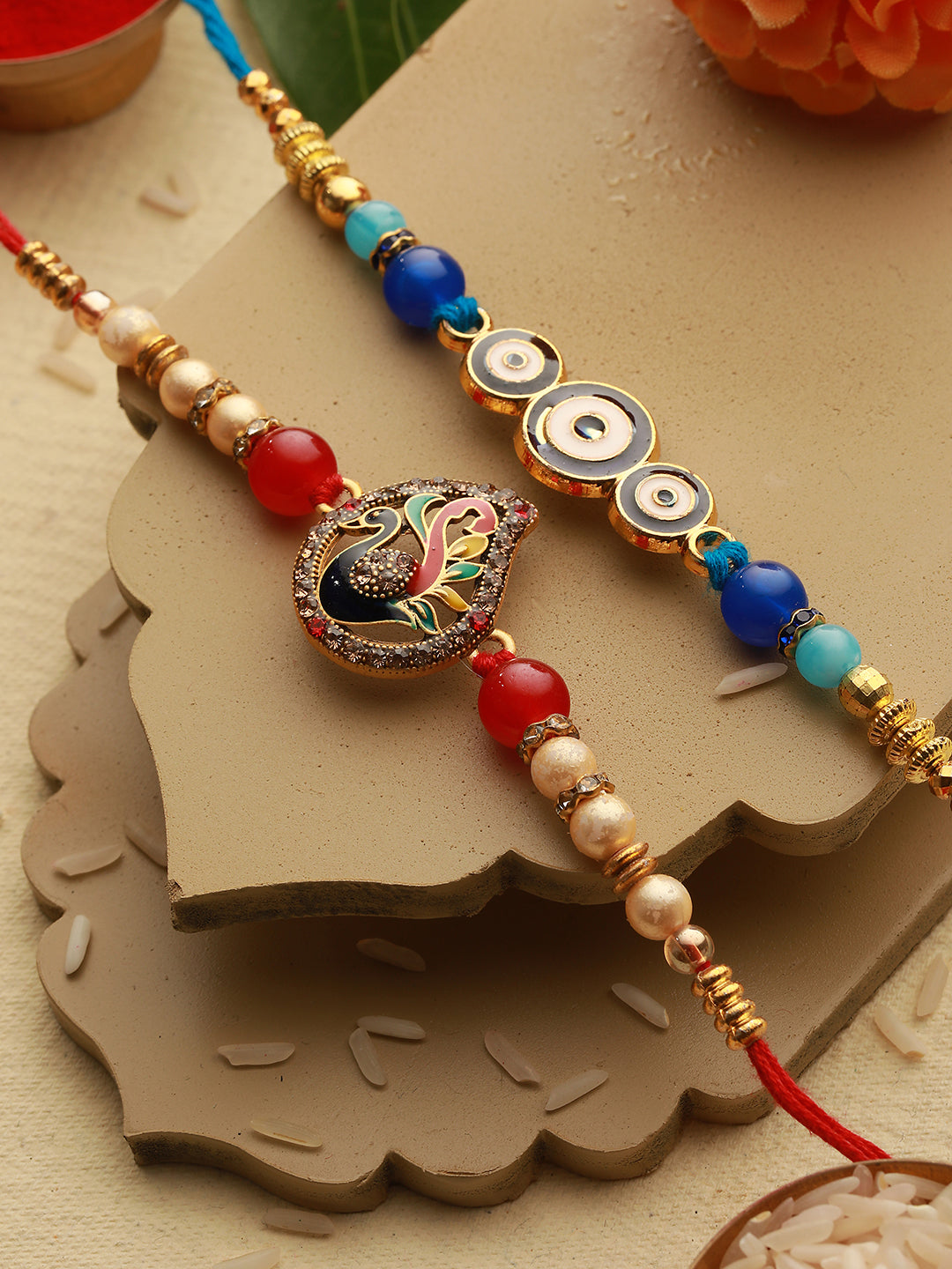Set of 2 Evil Eye nd Peacock Rakhi with Roli Chawal with 10 gram Shri Laxmi round 999 Round Silver Coin