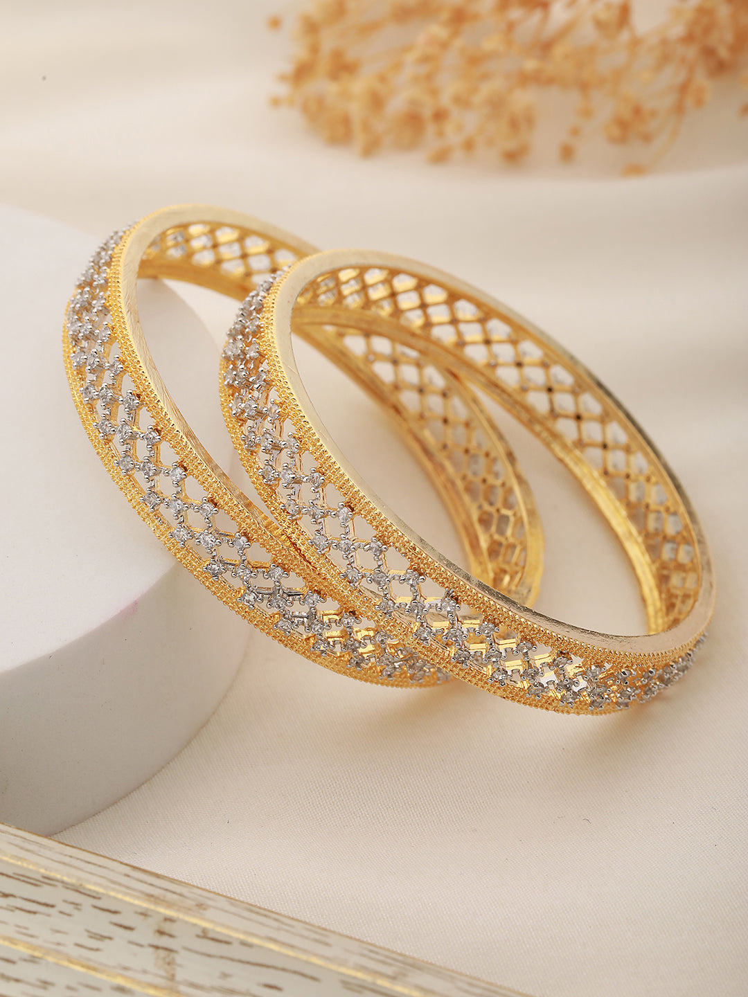 A pair of 2 Gold Dual  Toned AD Studded hand Crafted  Textuerd Bangles