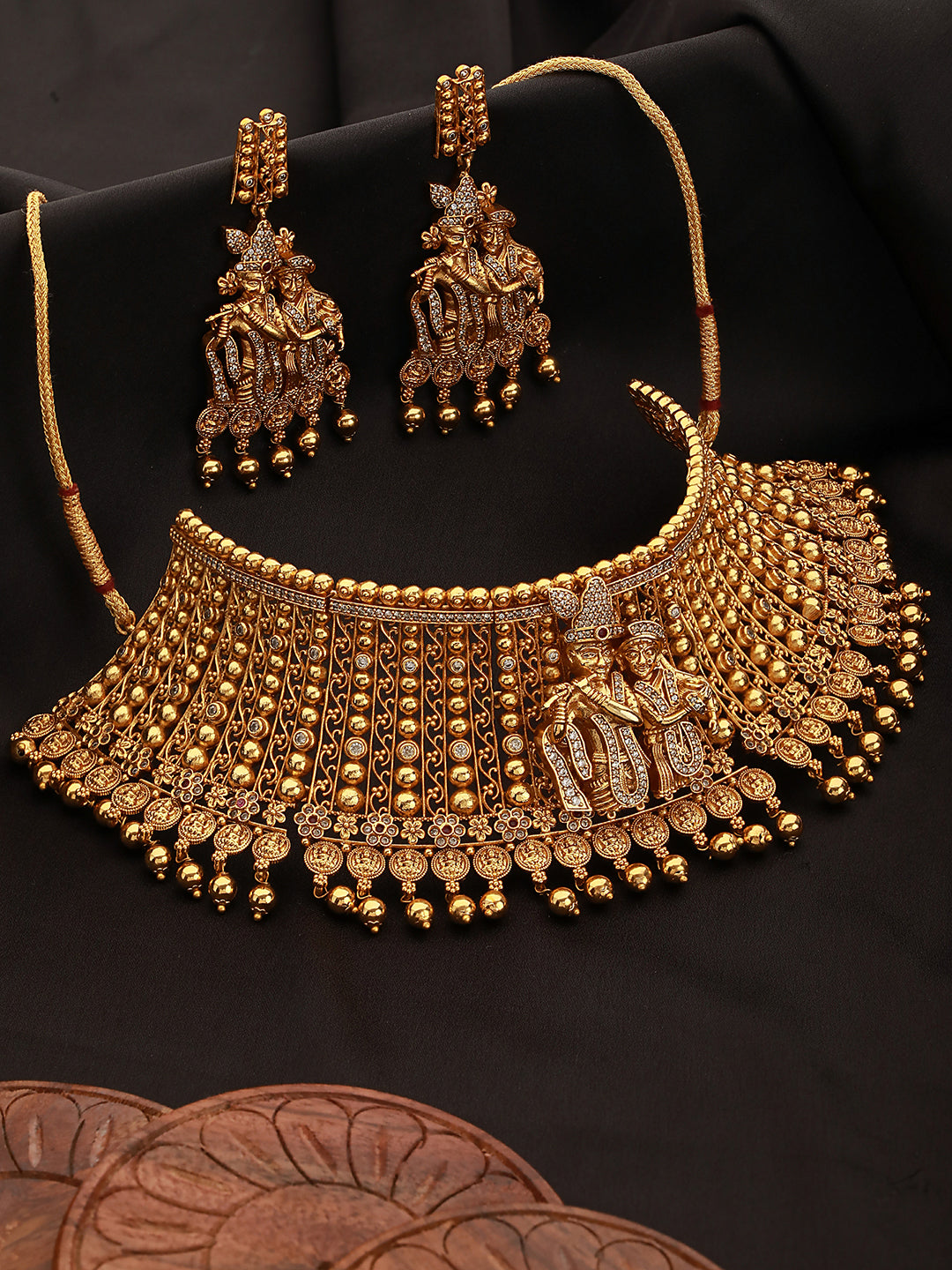 GoldPlated White AD Embellished Temple Radhe Krishna Choker Jewellery Set