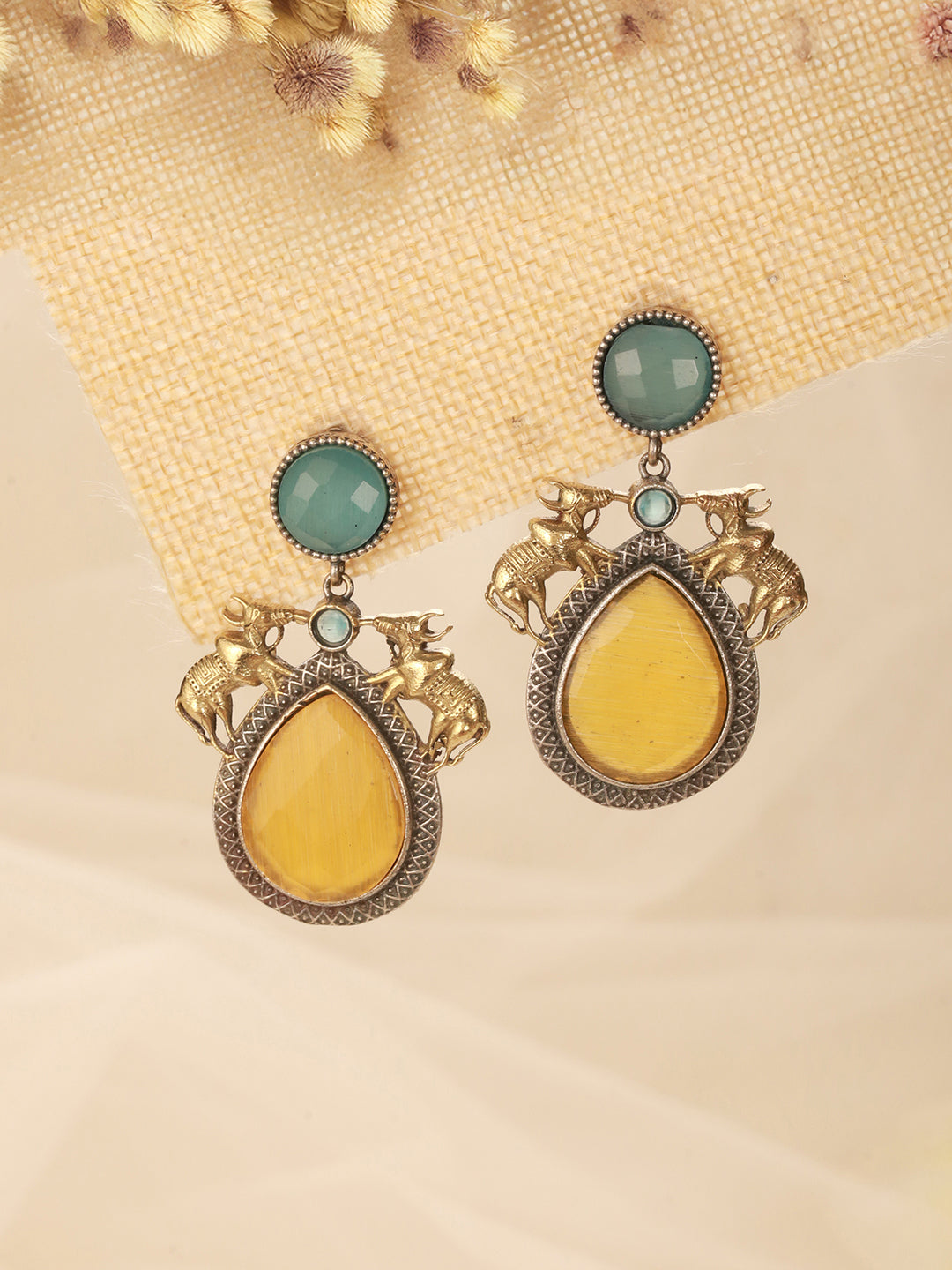Silver Oxidised Yellow Stone Studded Bull Motif Statement Chandbali Earrings