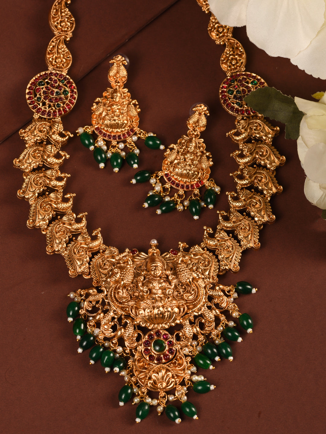 Gold Plated Multi stone studded Handcrafted Exquisite Lakshmi ji & Peaacock Design Temple Jewellery Set