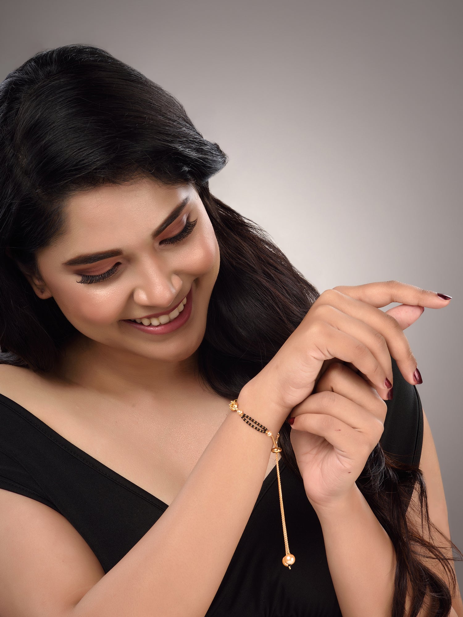 Gold Plated White AD Studded Black Beaded adjustable Mangalsutra Bracelet