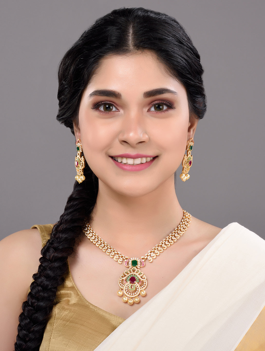 Gold Plated Multi AD & Pearl studded Intricate Design Pendant Necklace and Earrings Set