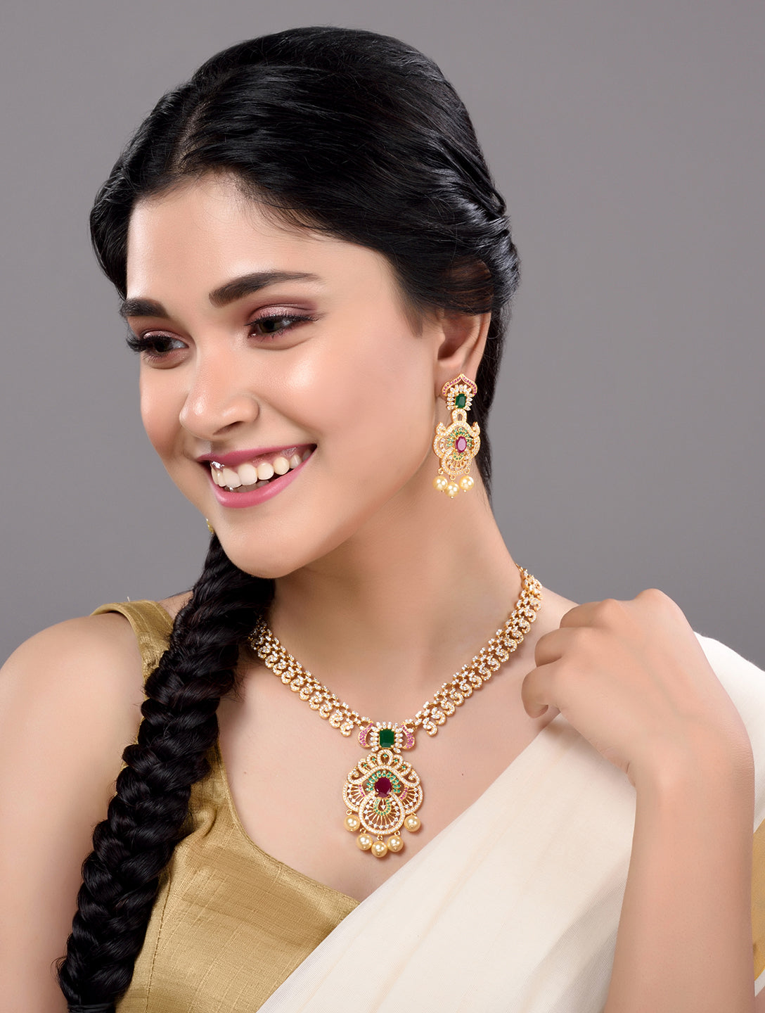 Gold Plated Multi AD & Pearl studded Intricate Design Pendant Necklace and Earrings Set