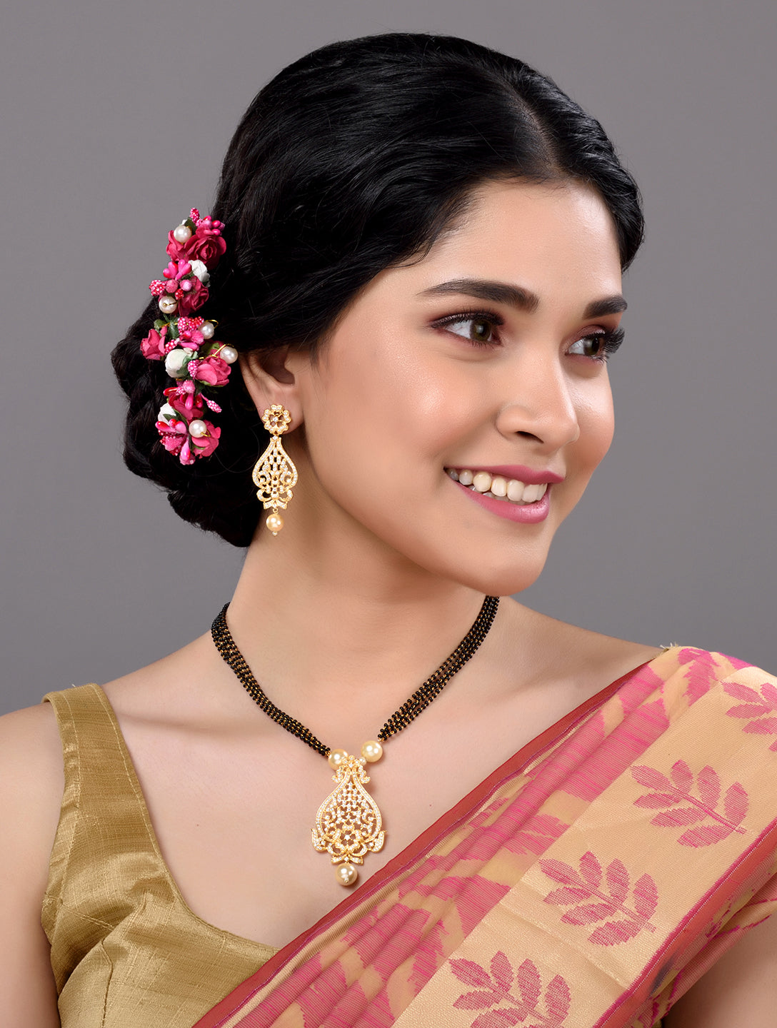 Gold Plated White AD and Pearl studded Antique Pendant Necklace Black Beads Pearl Mala and Earrings