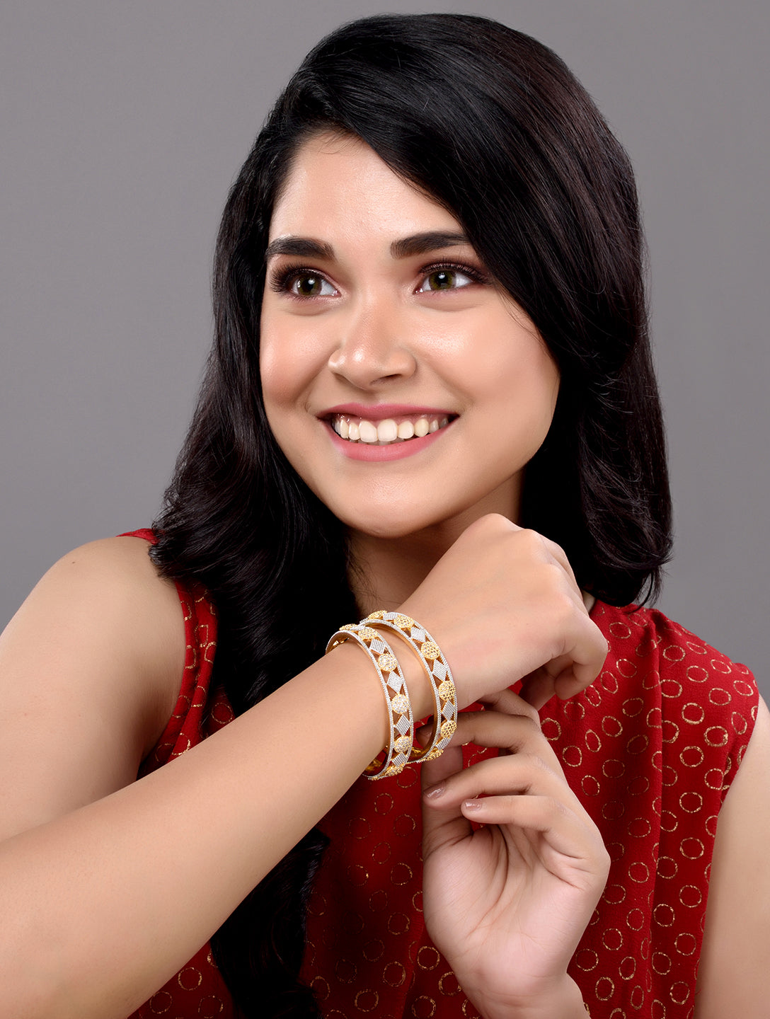 A Pair of 2 Gold Toned Intricate design Bangle Bracelet