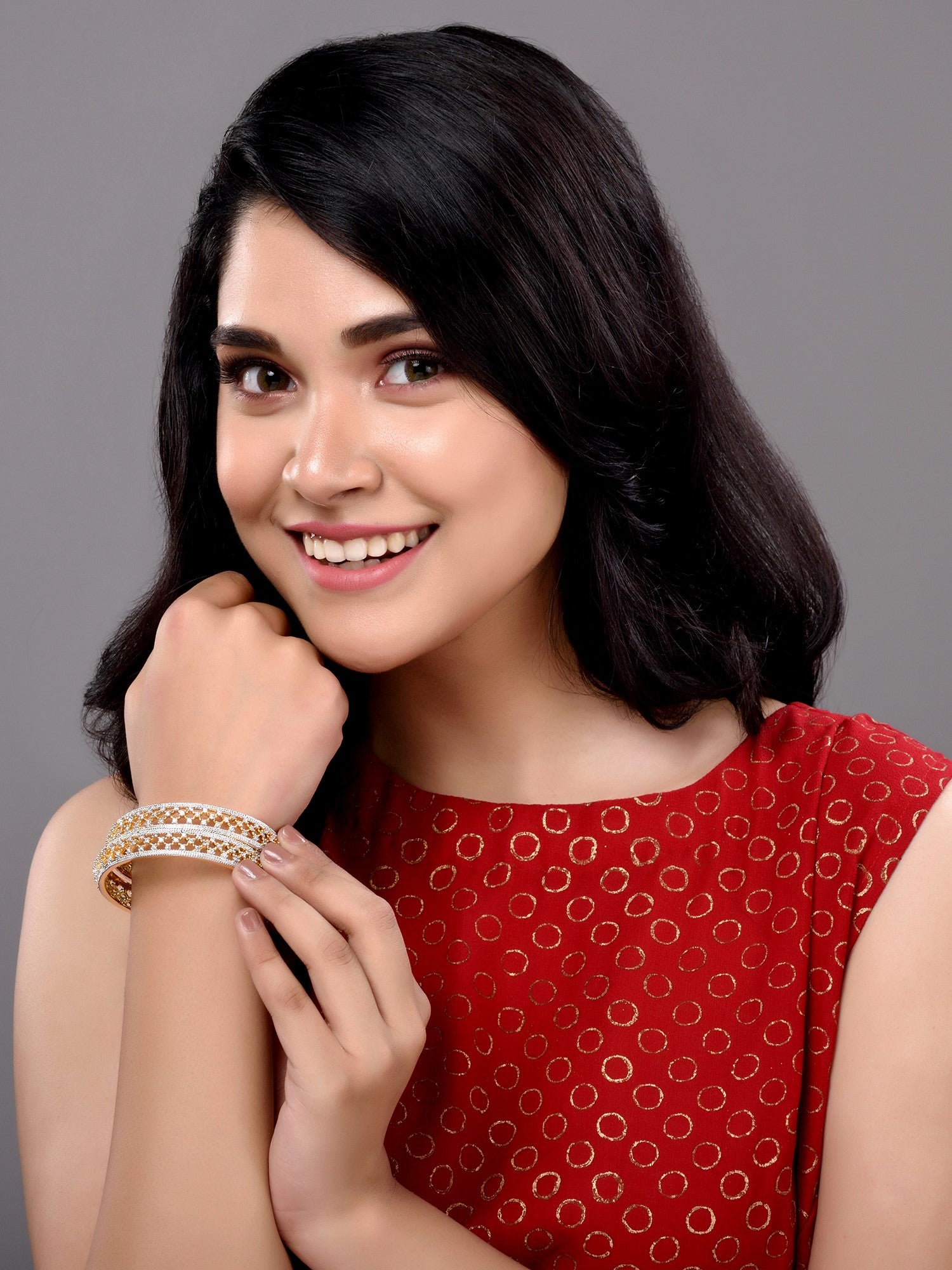 A pair of 2 Gold Dual  Toned AD Studded hand Crafted  Textuerd Bangles