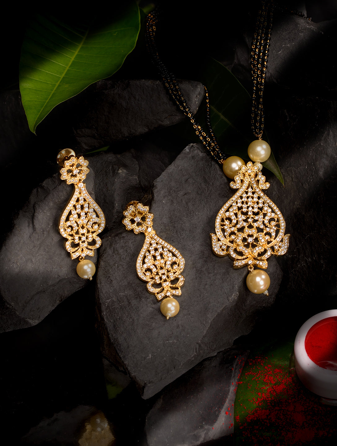 Gold Plated White AD and Pearl studded Antique Pendant Necklace Black Beads Pearl Mala and Earrings