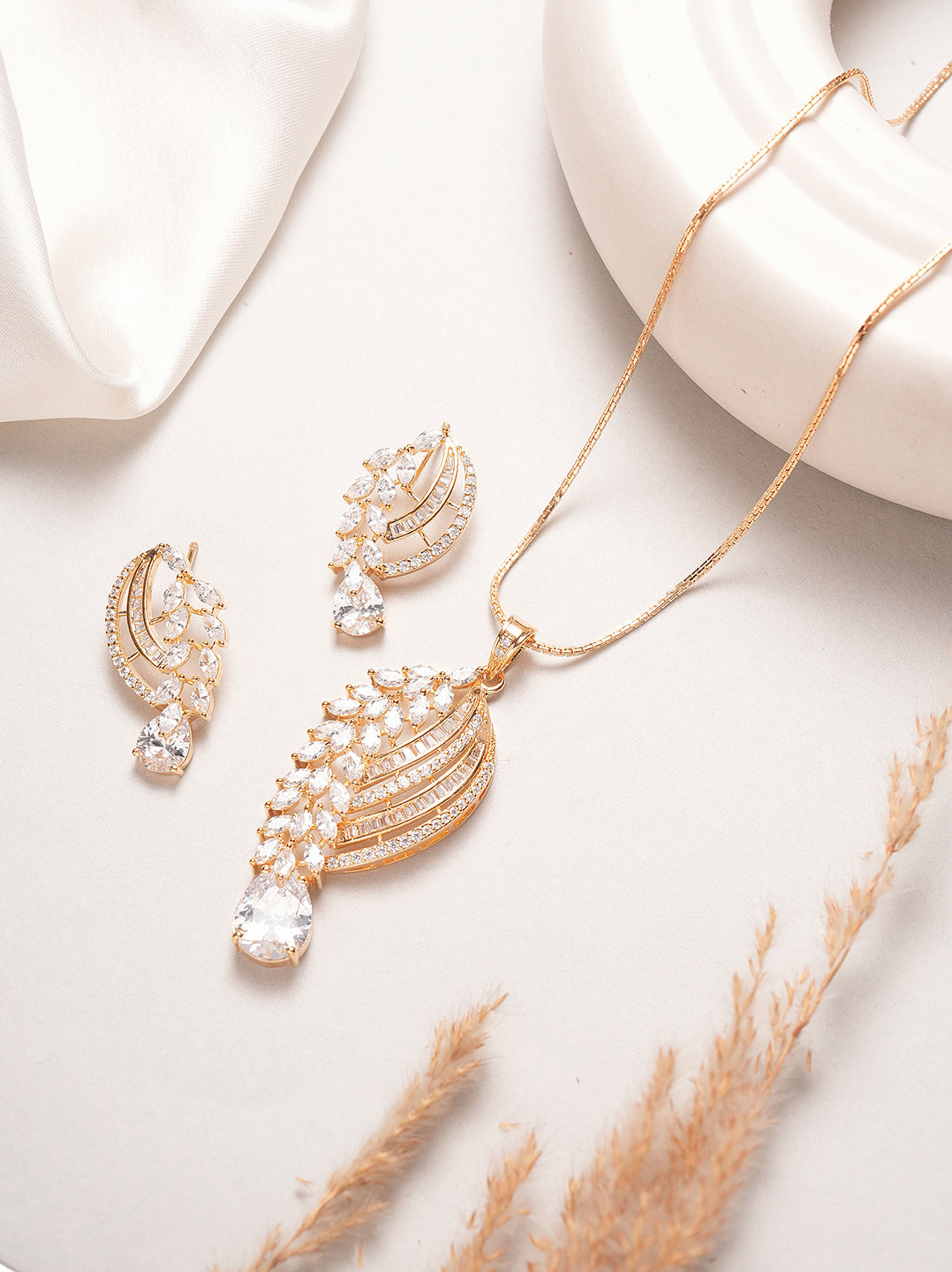 Rose gold plated AD paisley leaf pendant set with drop stone