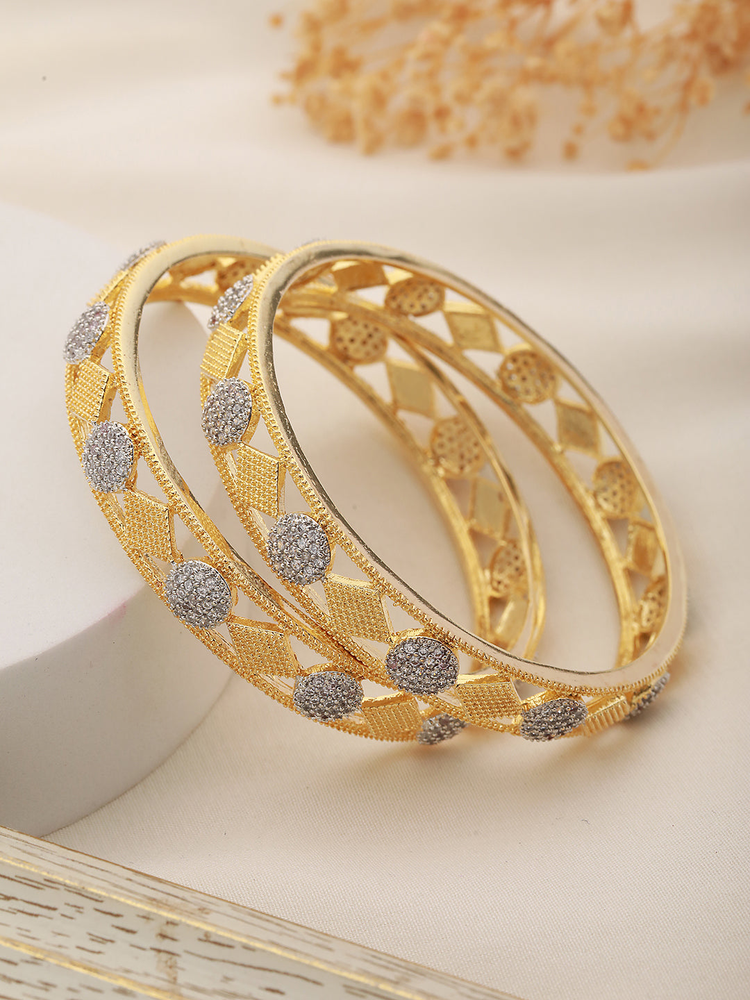 A Pair of 2 Gold Toned Intricate design Bangle Bracelet