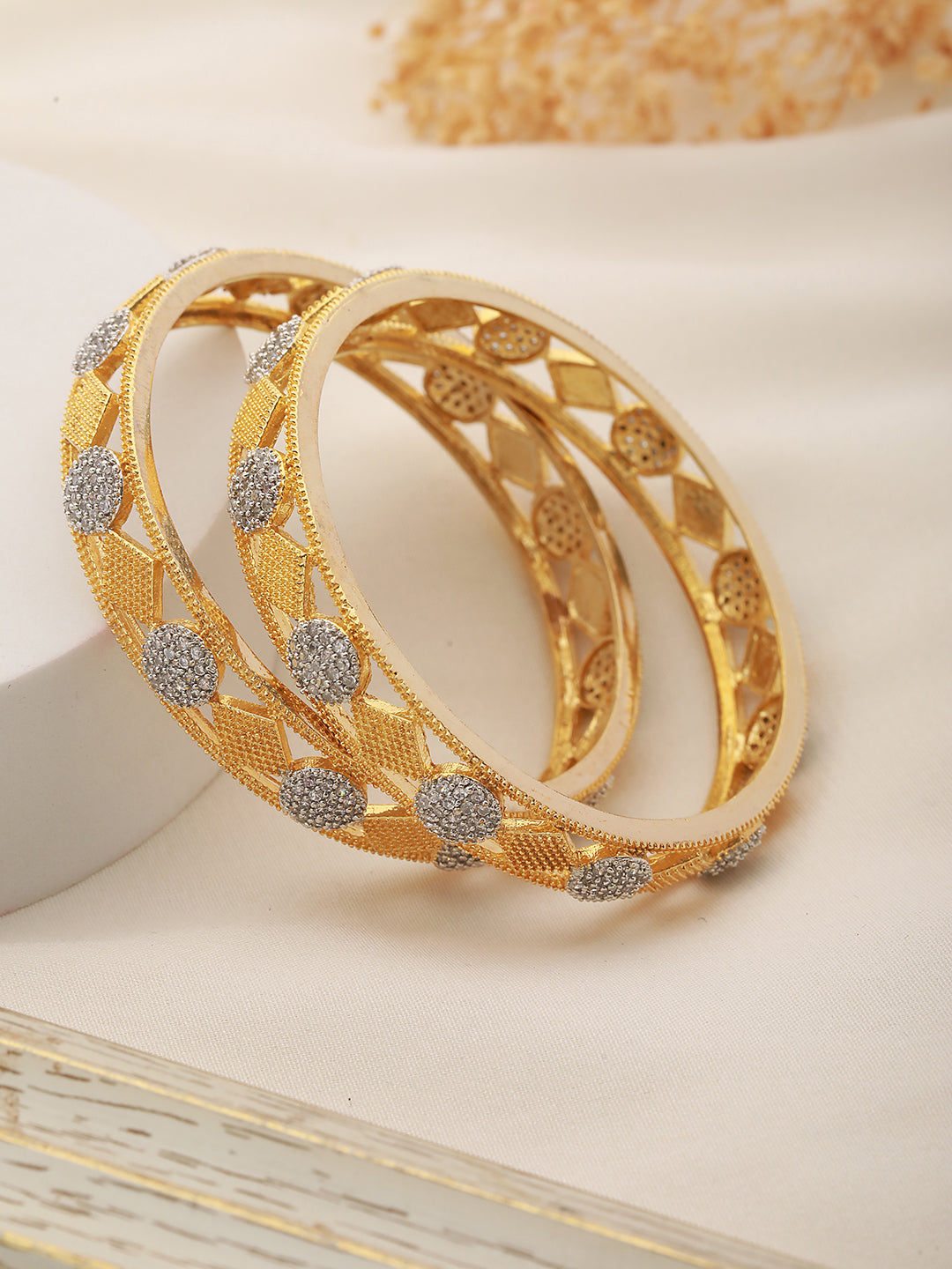 A Pair of 2 Gold Toned Intricate design Bangle Bracelet