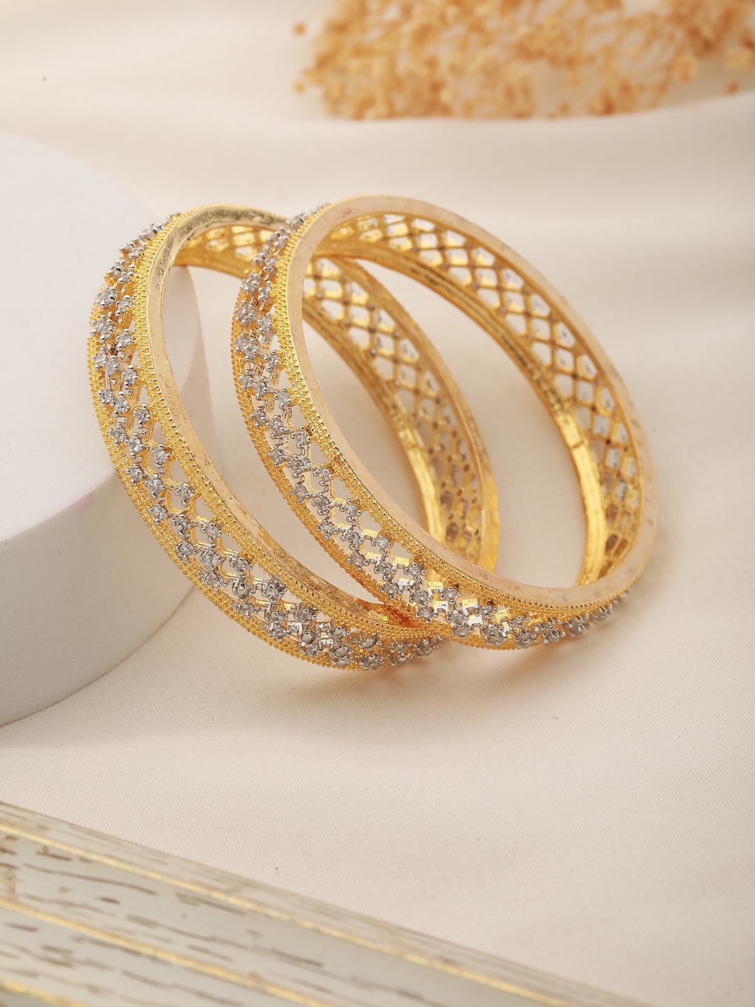 A pair of 2 Gold Dual  Toned AD Studded hand Crafted  Textuerd Bangles