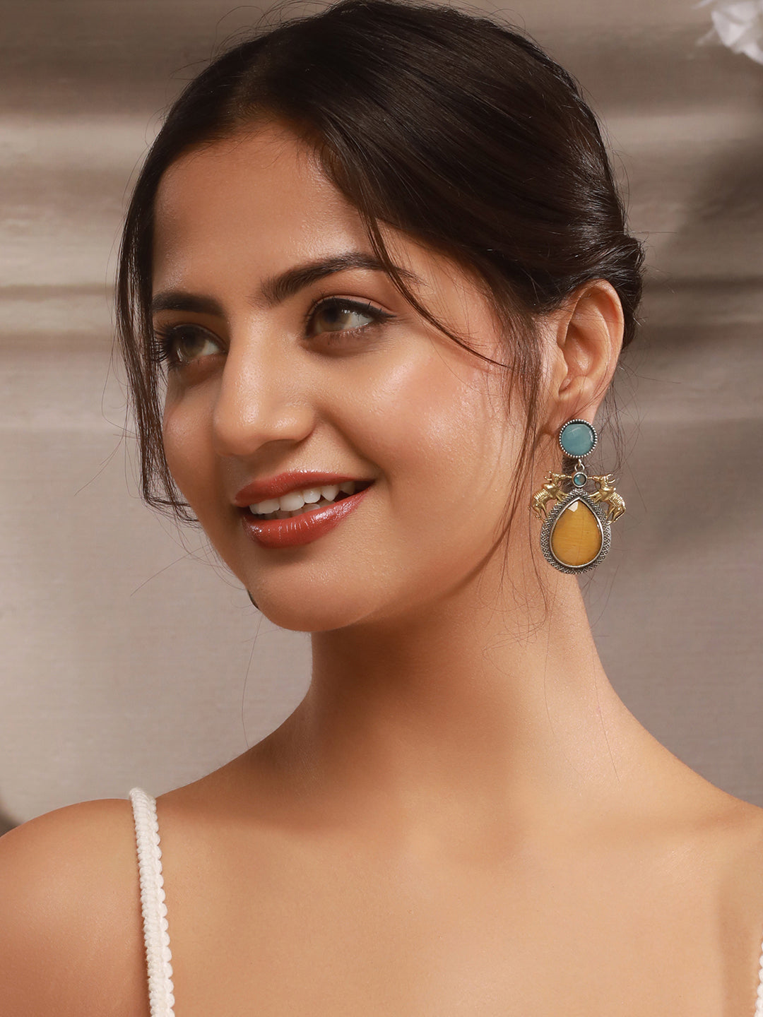 Silver Oxidised Yellow Stone Studded Bull Motif Statement Chandbali Earrings